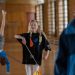 Children having fun in a school gym, with gymnastics and playful activities.